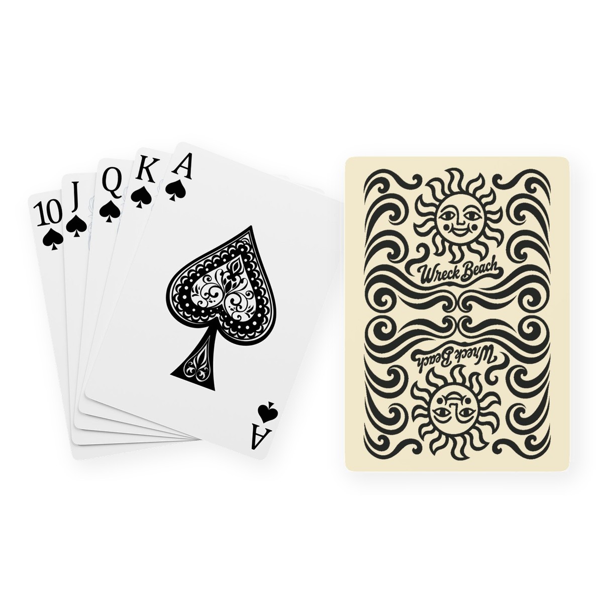 A poker hand of spades fanned out beside a cream playing card back printed in black with mirrored smiling suns, curling waves and Wreck Beach lettering