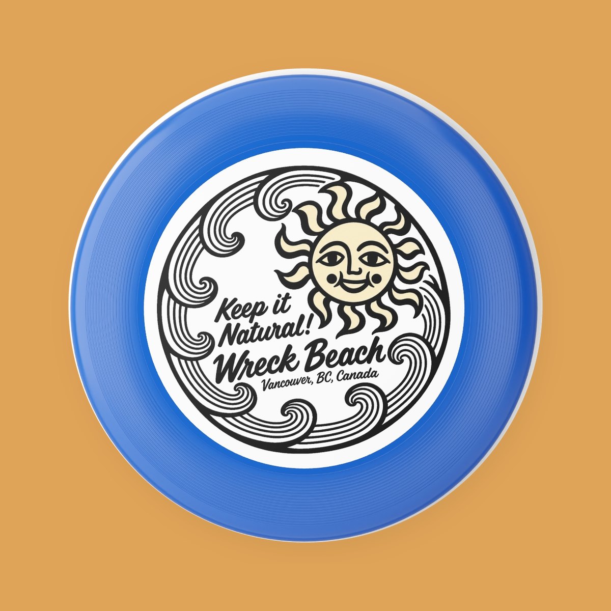 Blue Wham-O frisbee printed with a smiling sun inside a ring of curling black waves, reading Wreck Beach, Vancouver, BC, Canada