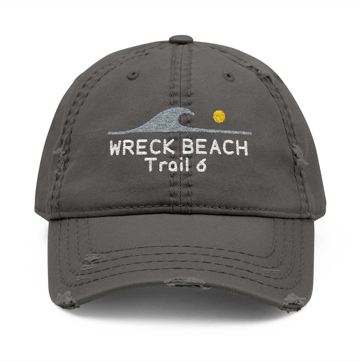 Distressed charcoal dad hat embroidered with an aqua breaking wave, a yellow sun and Wreck Beach, Trail 6